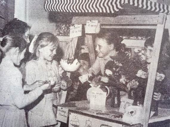 Fulwell youngsters improve their French by buying and selling goods at the 'French shop' in the school in 1972.