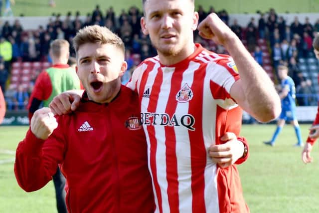 Charlie Wyke celebrates the win at Rochdale.