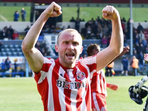 Dylan McGeouch celebrates the victory.