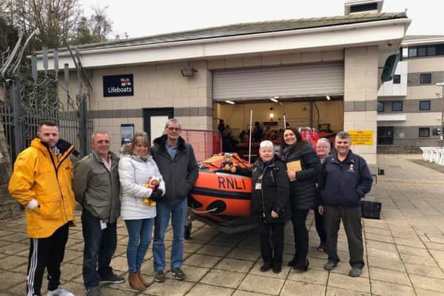Family and friends of Mark Langton make a donation to Sunderland RNLI. Picture: Andy McGill/RNLI.