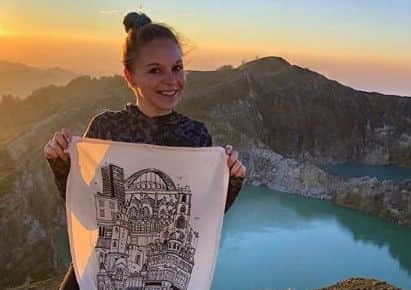 Helen Wilson with the Mackem tea towel at Kelimutu Lake in Indonesia