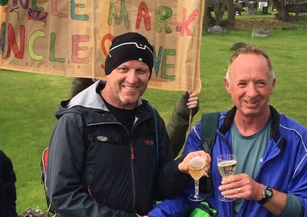 Steve Burn (left) and Mark Howells arrive at Silksworth in Sunderland after running from Rochdale in Greater Manchester.