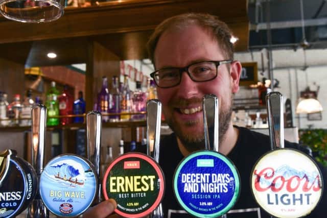 Steve Smith proudly displays the new Vaux beer pump clips