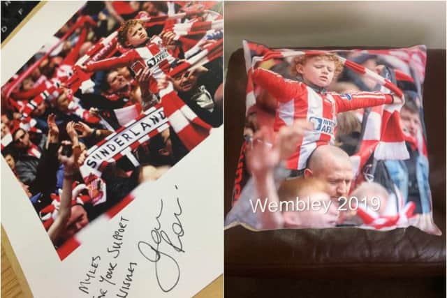 A signed photograph from Sunderland manager Jack Ross and the cushion made to commemorate their trip. Picture: Craig Price.