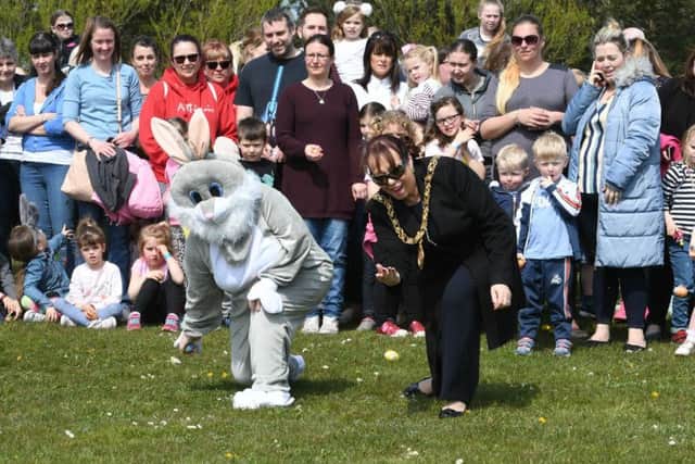 Mayor Coun Lynda Scanlan and the Easter Bunny try their hand at egg rolling