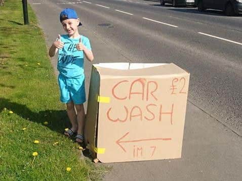 Ashton Murray has set up his own car wash to raise funds.