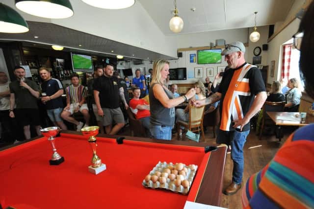 Customers at the Hearts of Oak pub enjoy the World Egg Jarping Championships.