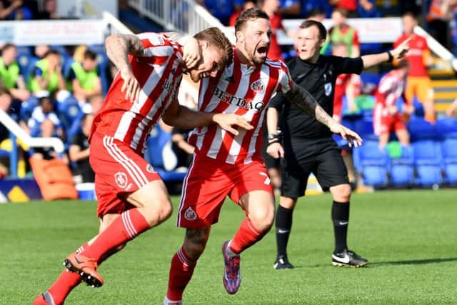 Max Power and Chris Maguire celebrate Sunderland goal at Peterborough United.