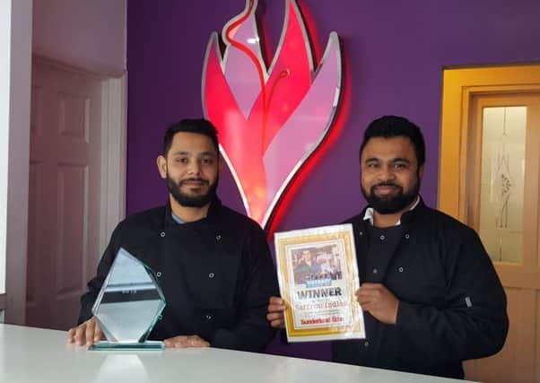 Left Rubel Islam and Abdul Kadir Jilane from Saffron Indian, celebrate winning the Echo Take Away of the Year 2019 winner.
