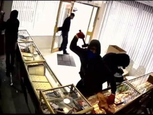 Masked hammer gang jailed for total of 50 years after £300,000 smash ...