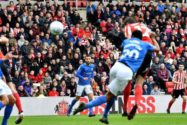Tom Flanagan heads Sunderland into an early lead against Portsmouth