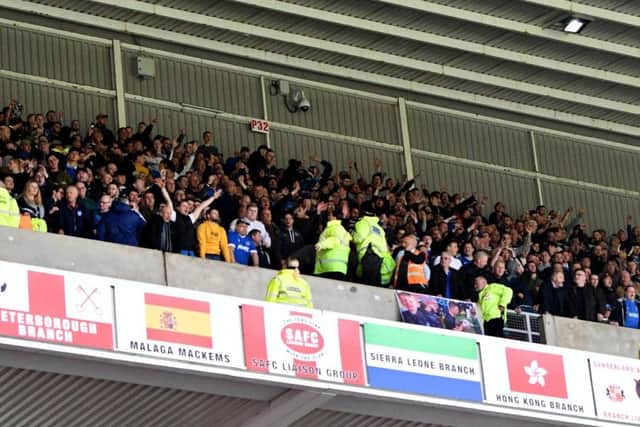 The Portsmouth supporters were housed in the upper tier of the North Stand, above a section of home fans.