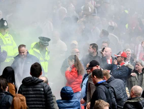 The flare in amongst the Sunderland fans at the Portsmouth fixture