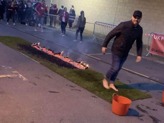 Carl Lowery takes part in the fire walk in honour of the Bradley Lowery Foundation.