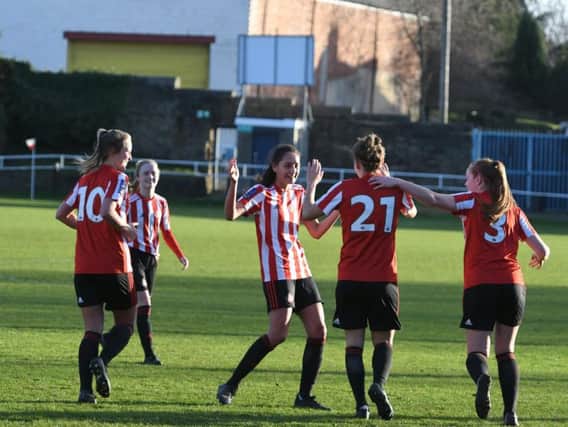 Mollie Lambert celebrates with her teammates after a dominant Sunderland display