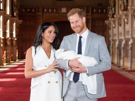 The Duke and Duchess of Sussex with their baby son, who was born on Monday morning, during a photocall in St George's Hall at Windsor Castle in Berkshire. PRESS ASSOCIATION Photo. Picture date: Wednesday May 8, 2019. See PA story ROYAL Baby. Photo credit should read: Dominic Lipinski/PA Wire