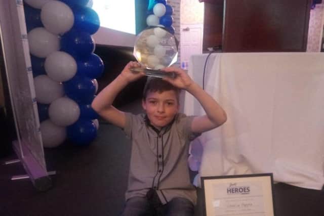 Charlie Hepple with his award.