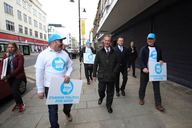 Nigel Farage walking the streets of Sunderland. 
Image by PA.