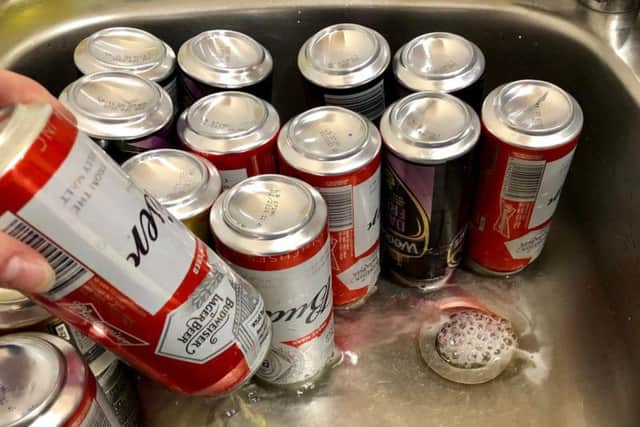 The illegal booze which police confiscated from school leavers in Durham is poured away. Pic: Durham City Police.