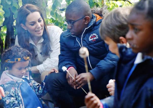 The Duchess of Cambridge toasting marshmallows with local schoolchildren at RHS Chelsea. Picture by RHS/Luke MacGregor