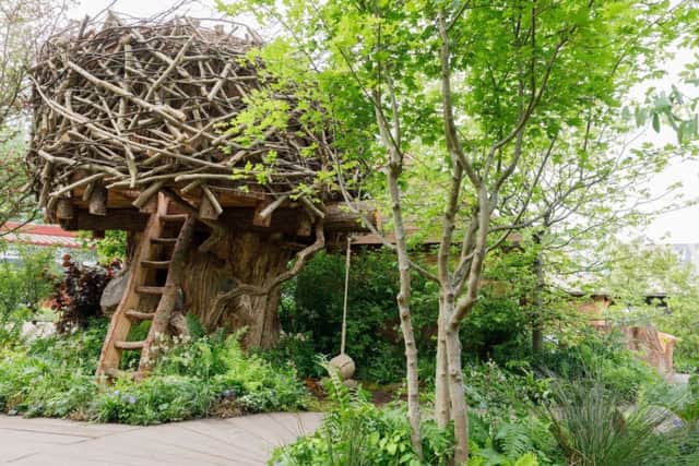 The tree house sits at the centre of the garden. Picture by RHS/Neil Hepworth