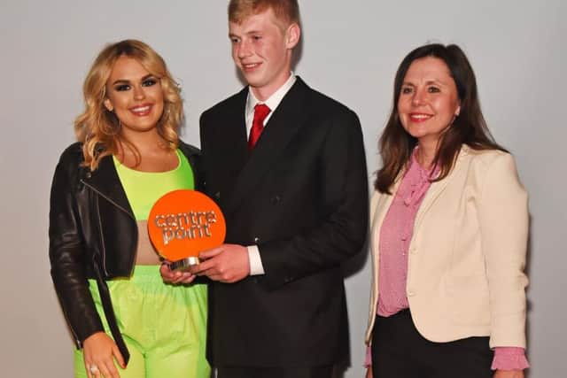 Luke Anderson receives his award from singer Tallia Storm and Lesley McPherson from sponsor of the award and Centrepoint partner The Co-operative Bank.