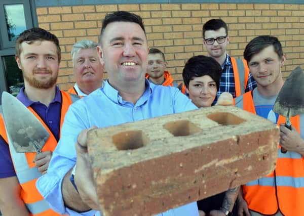SJL Brickwork celebrates 20 years in business. MD Steven Lynn with team staff and apprentices