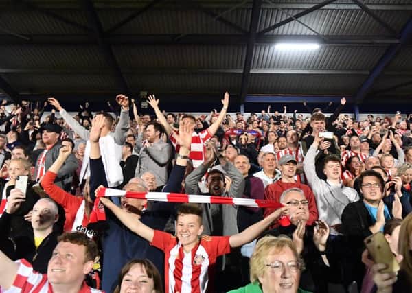 Fans celebrate after last night's play-off semi-final win