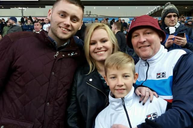 Newcastle United fan Gary Bell with stepson Josh, daughter Abbey and son Jack.