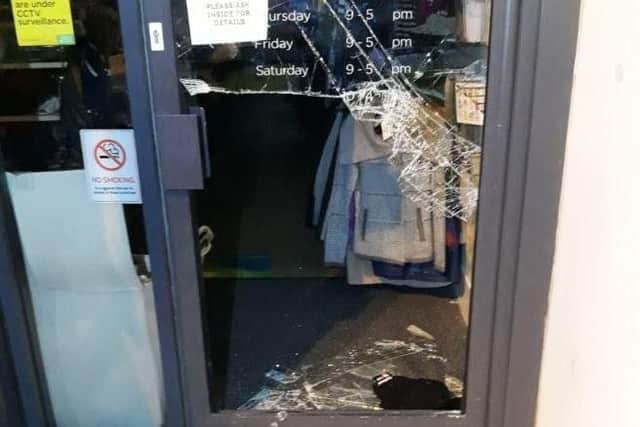 The smashed shop door