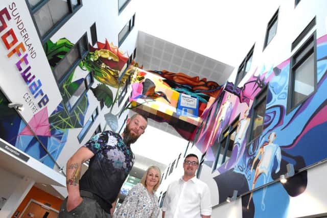 Artist Frank Styles, Sunderland Software Centre Manager Berni Whitaker and Coun Michael Mordey