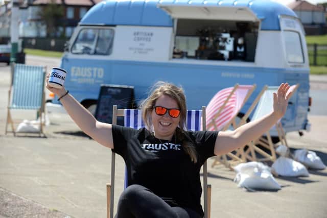 Fausto's Lesley Mearns enjoying the high temperatures with the Faustino coffee machine van at Seaburn Beach.