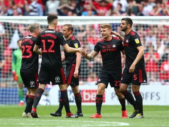 Sunderland players celebrate the opening goal against Charlton.