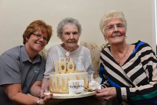 Mary Murray celebrates her 100th birthday with granddaughter Andrea Flood and daughter Pauline Curley.