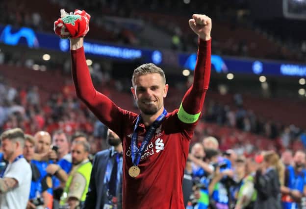 Liverpool's Jordan Henderson celebrates after winning the UEFA Champions League Final at the Wanda Metropolitano, Madrid. Picture by Peter Byrne/PA Wire.