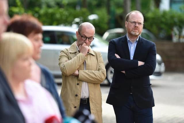 Investigative journalists Barry McCaffrey, left, and Trevor Birney listen to Niall Murphy, solicitor for relatives of those killed in Loughinland, following a public meeting of the Policing Board in Belfast about their controversial arrest. Pic: Michael Cooper/PA Wire.