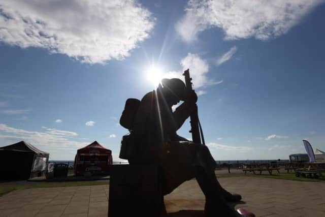 The sun shining on Seaham's Tommy statue.