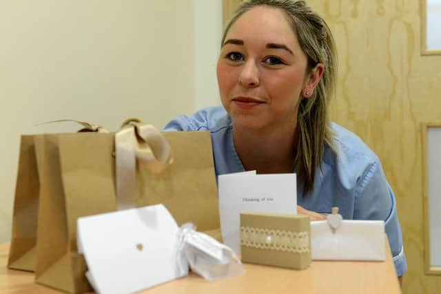Kayleigh Brown, emergency department nurse at Sunderland Royal Hospital, with items from the support pack for families who have lost loved ones.