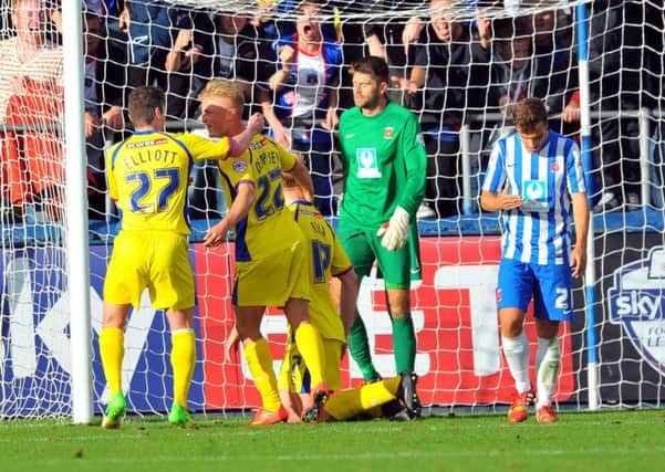 THE FINAL STRAW: Carlisle United players celebrate their 3rd goal in front of Hartlepool United keeper Scott Flinders. Picture by FRANK REID