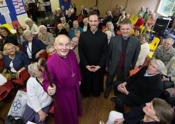 COMMUNITY LIFE: From left, Bishop of Jarrow, the Right Rev Mark Bryant, with ordinands Michael Volland and Mark Tanner, with the parishioners.