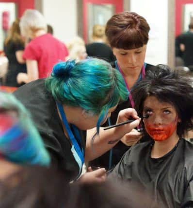 BLOODY GREAT: Students practice their make up skills.