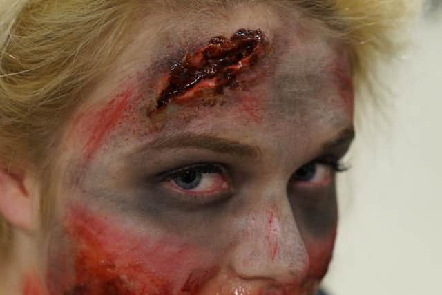 ZOMBIE LOOK: A student make up as a zombie.