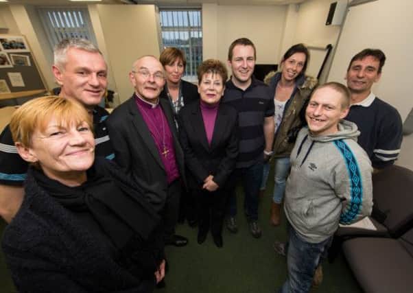 RECOVERING ... The Lord Lieutenant of Durham, Sue Snowdon, centre, and Bishop of Jarrow, the Revd Mark Bryant, left, meet staff and members of the Public Health Recovery Academy.