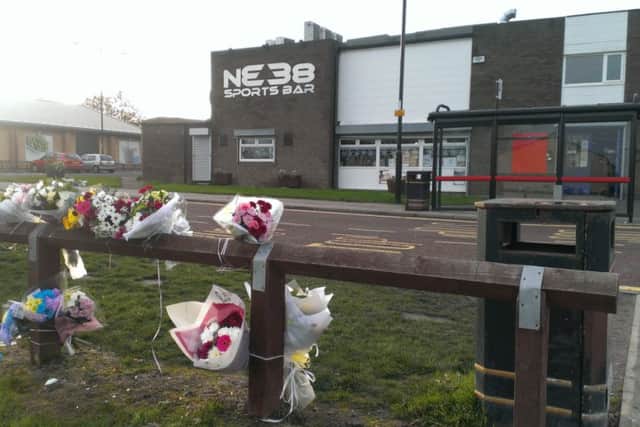 Flowers left outside the NE38 Sports Bar in Bamston following the death of John Potts.