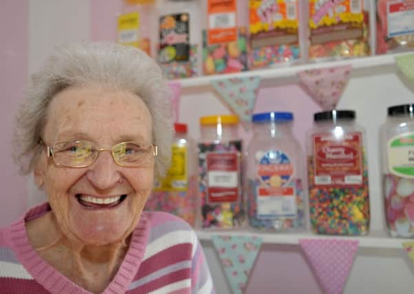 Field View Care Home handyman resident Sylvia Churchill in the sweet shop.