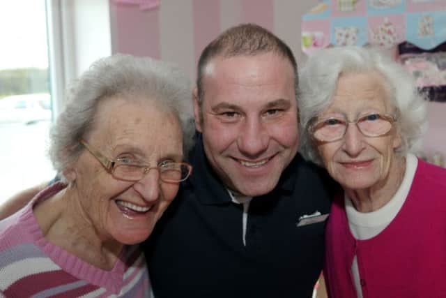 Field View Care Home handyman Ian Noble who created the sweetie shop with residents Sylvia Churchill (left) and Joyce Young.