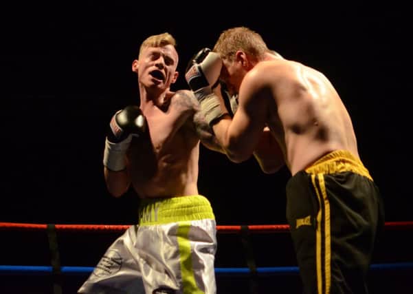 GOOD DEBUT: Liam Cammock (left) on the way to victory over  Mick Mills. Picture by JOE SPENCE