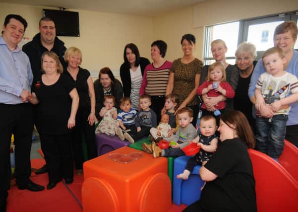 WELCOME BOOST: Denise Eden, who started the Little Rascals playgroup, thanks John Bloomfield, secretary of the Houghton Round Table for their donation of £400 to the playgroup.