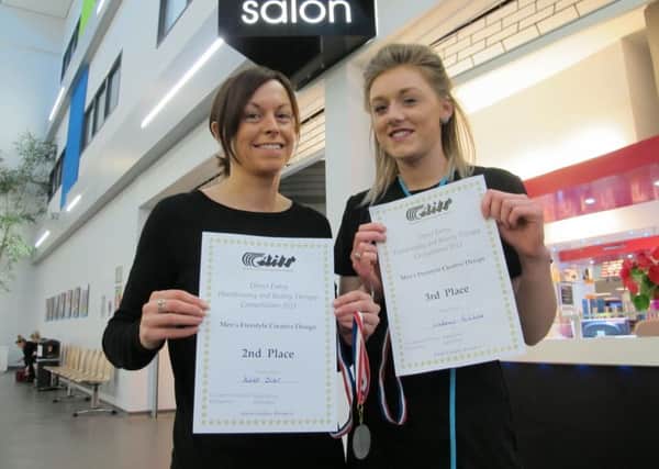 CUTTING IT: National competition winners Karen Scarr, left, and Lindsay Ruddock.