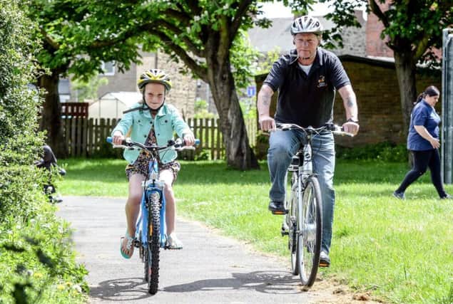 Tony Semley (Sunderland Young Peoples Bike Project) and Jade Maskell, 7, go for a ride along one of the many routes that make up the Washington Way.